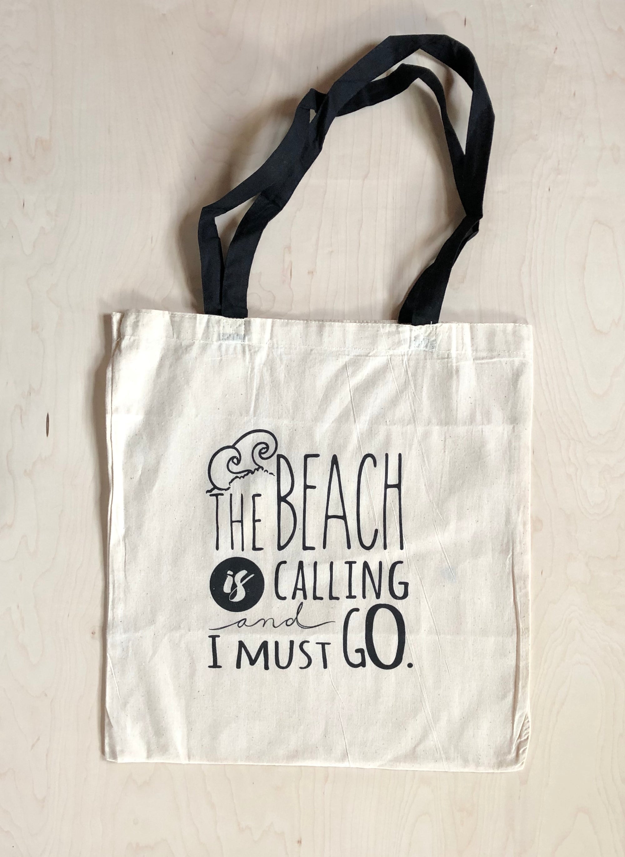 “The beach is calling and I must go” Tote Bag